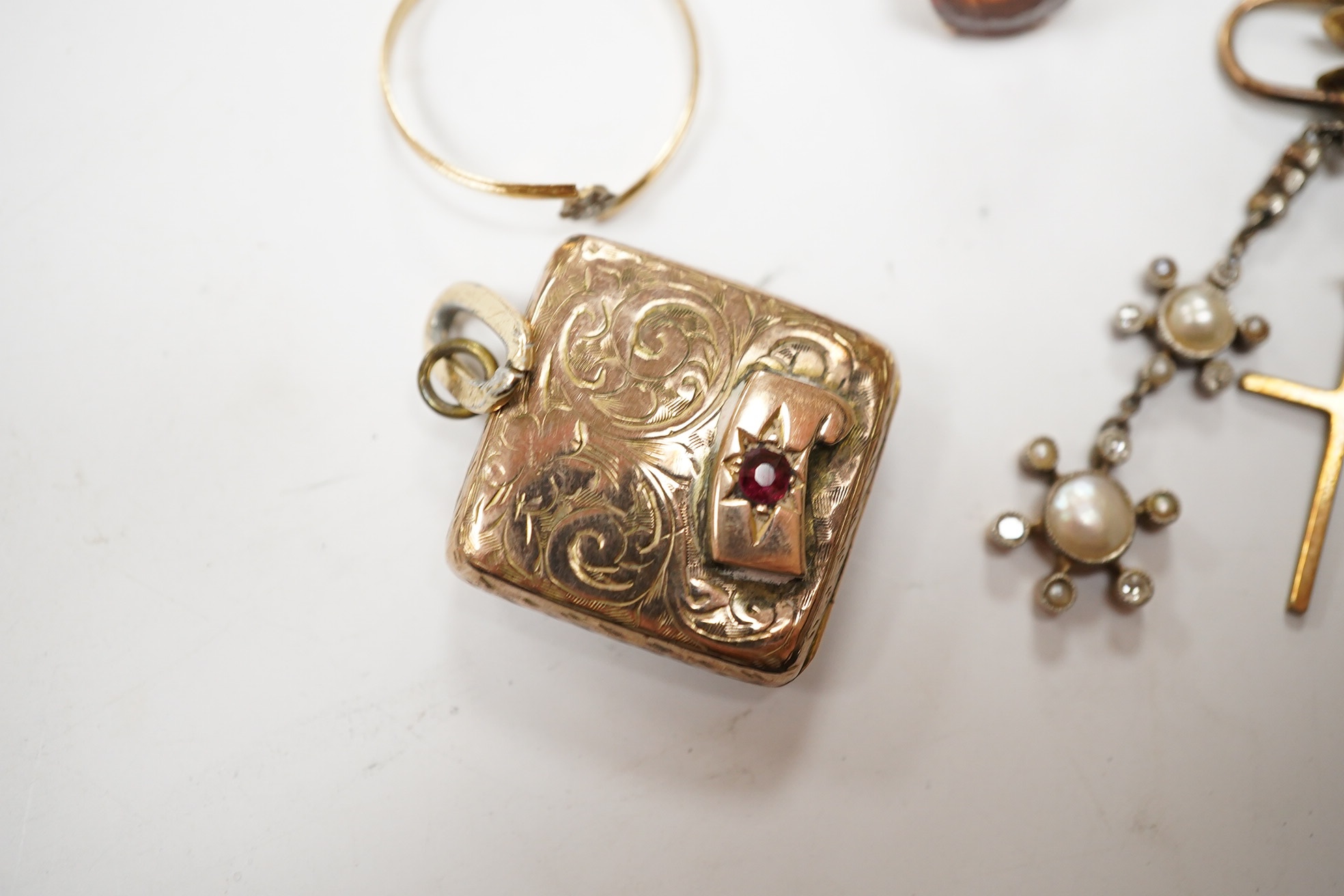 Sundry jewellery including a yellow metal and hessonite garnet set ring, a single yellow metal, seed pearl and diamond cluster set drop earring, locket, cross and a ring. Condition - poor to fair